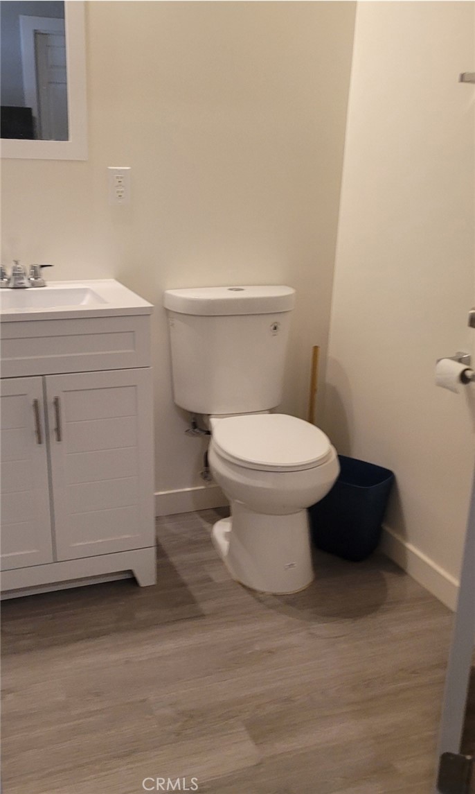 1211 Nancy Street Barstow, CA 92311 - Photo 2 of 2 a bathroom with a sink toilet and vanity