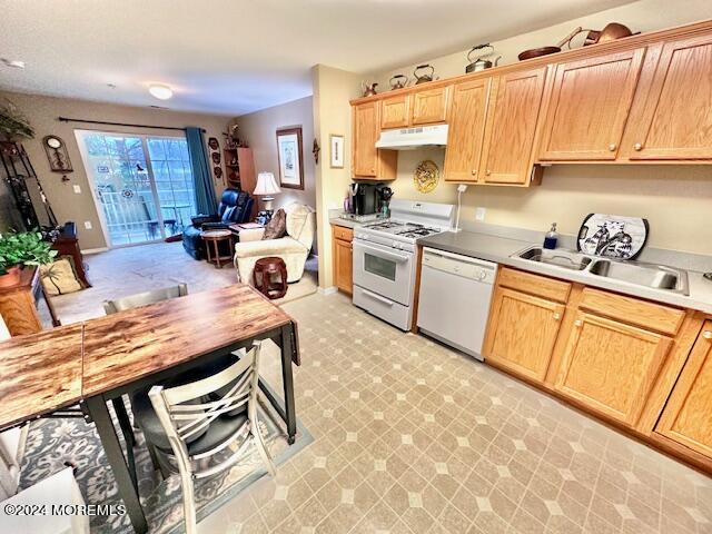 185 Liddle Avenue Edison, NJ 08837 - Photo 12 of 19 a kitchen with stainless steel appliances granite countertop a stove a sink dishwasher and cabinets with wooden floor