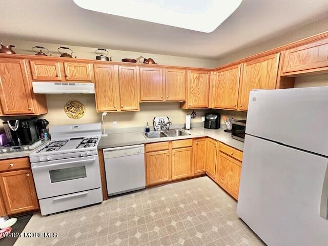 185 Liddle Avenue Edison, NJ 08837 - Photo 13 of 19 a kitchen with a refrigerator a stove a sink and white cabinets