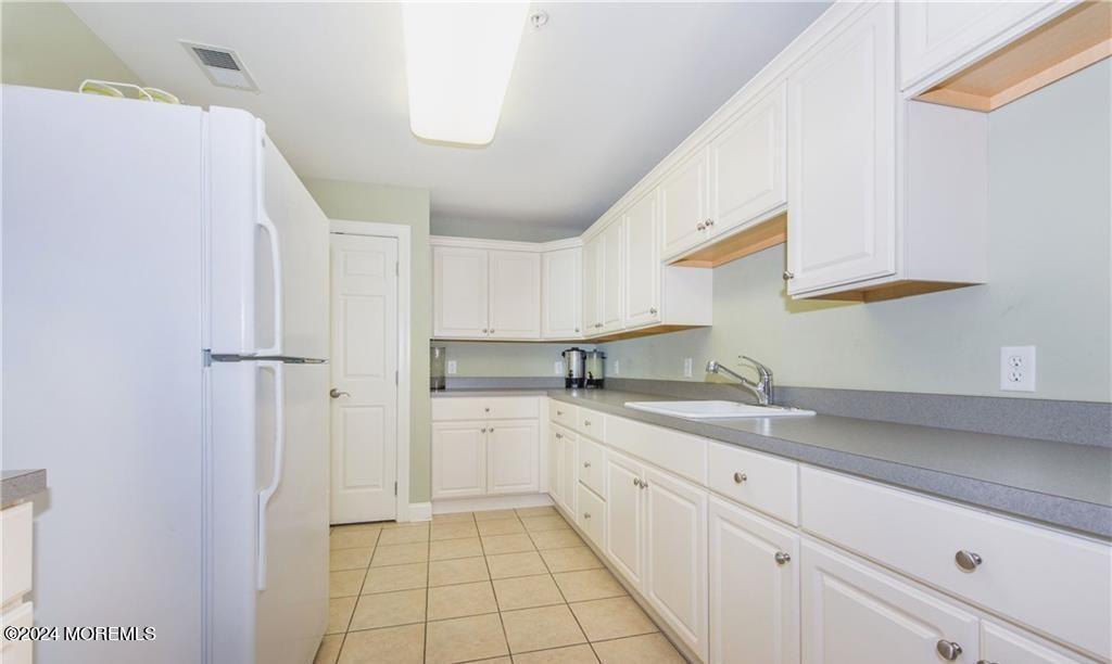 185 Liddle Avenue Edison, NJ 08837 - Photo 17 of 19 a kitchen with a sink appliances and cabinets
