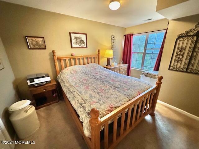 185 Liddle Avenue Edison, NJ 08837 - Photo 8 of 19 a bedroom with a bed and wooden floor