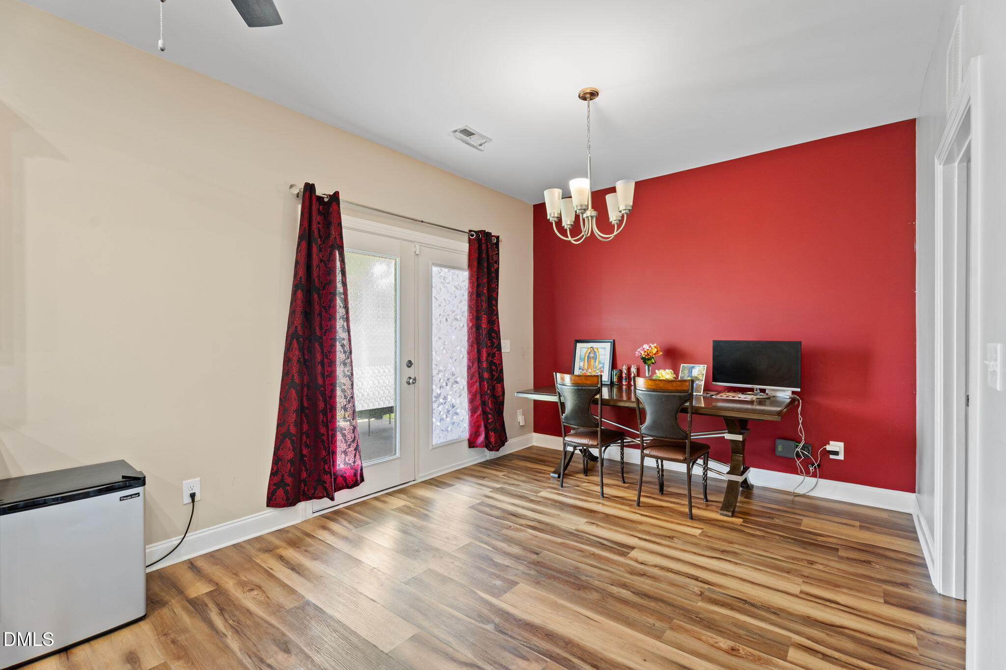 202 South 6th Street Erwin, NC 28339 - Photo 13 of 35 a view of a living room with furniture and chandelier