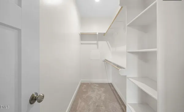 a bathroom with double sink and a mirror