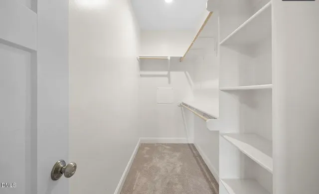 a bathroom with double sink and a mirror