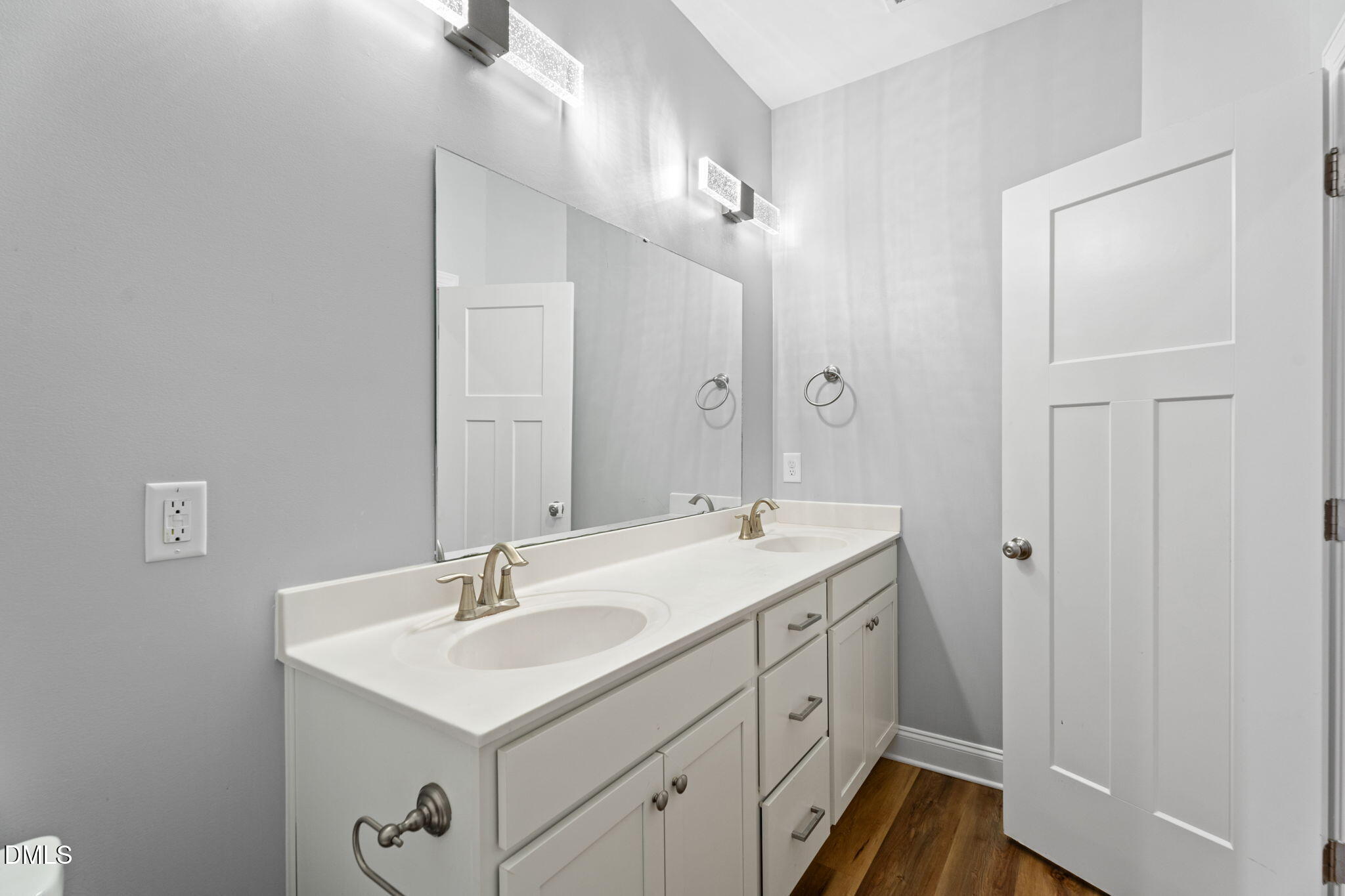 202 South 6th Street Erwin, NC 28339 - Photo 22 of 35 a bathroom with a sink a light fixture a vanity and a mirror