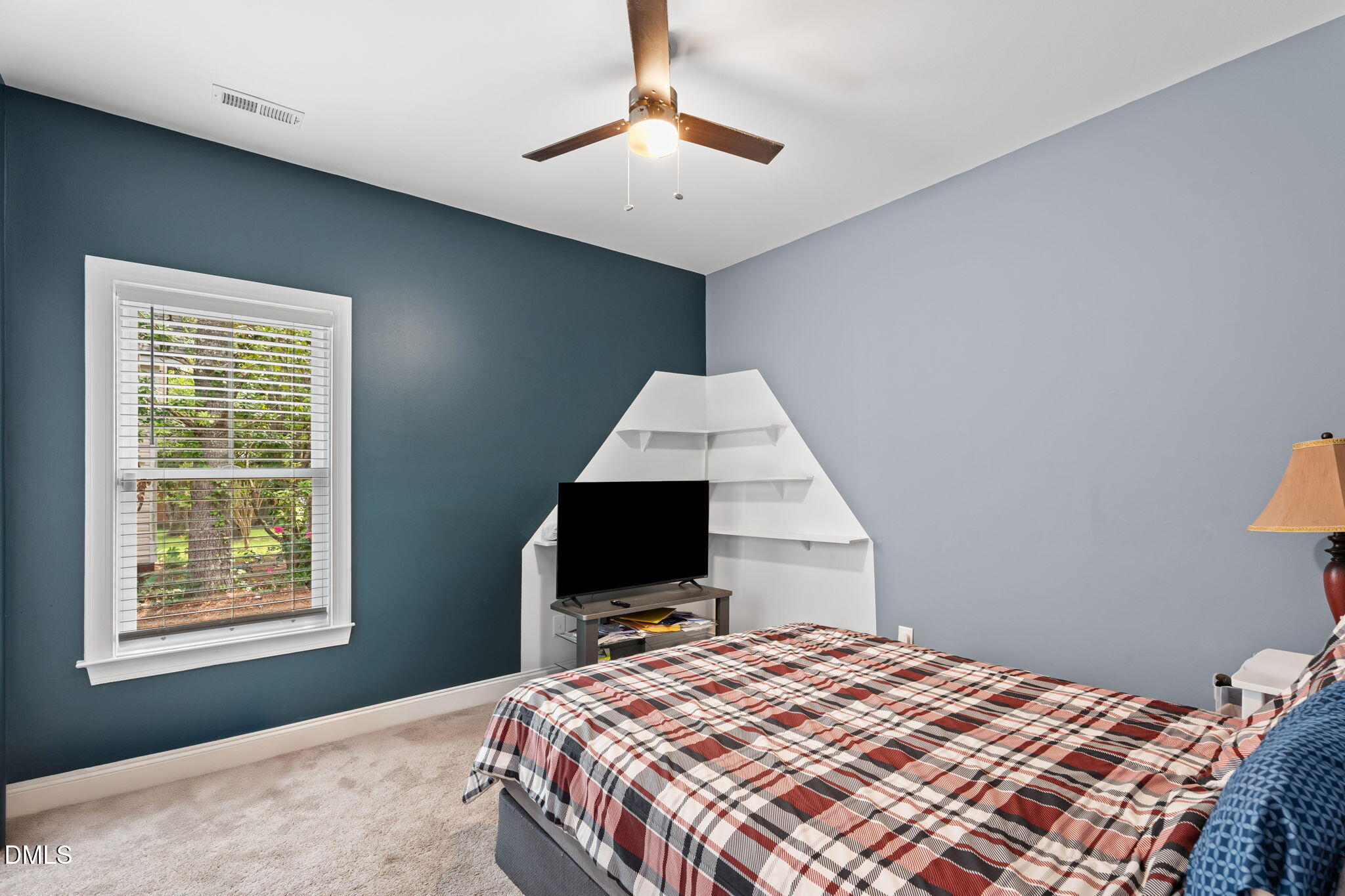 202 South 6th Street Erwin, NC 28339 - Photo 25 of 35 a bedroom with a bed flat screen tv and a window