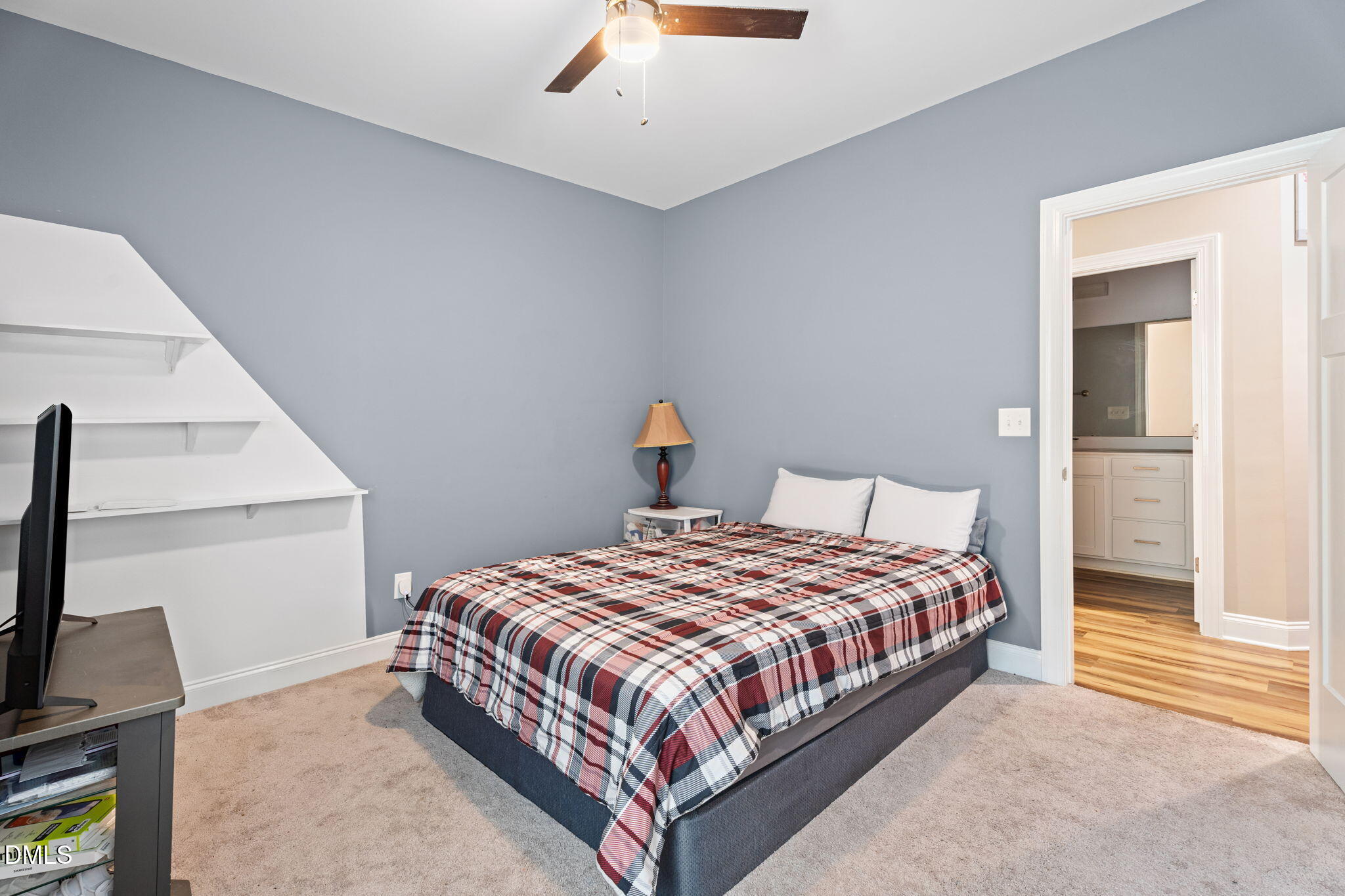 202 South 6th Street Erwin, NC 28339 - Photo 26 of 35 a bedroom with a bed and a flat screen tv