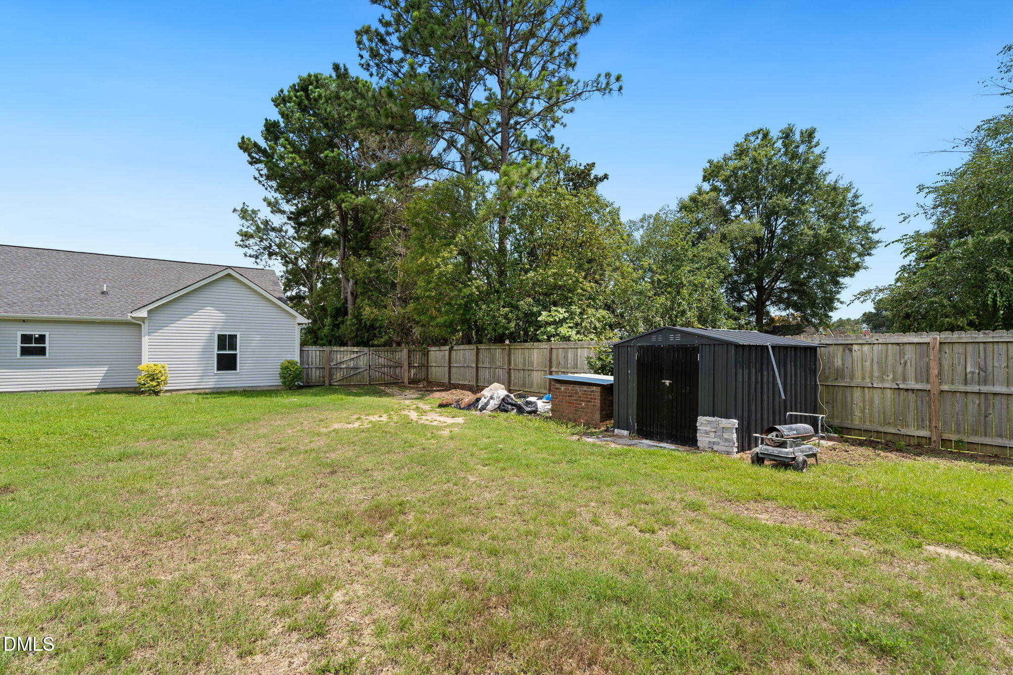 202 South 6th Street Erwin, NC 28339 - Photo 30 of 35 a view of a house with backyard and sitting area