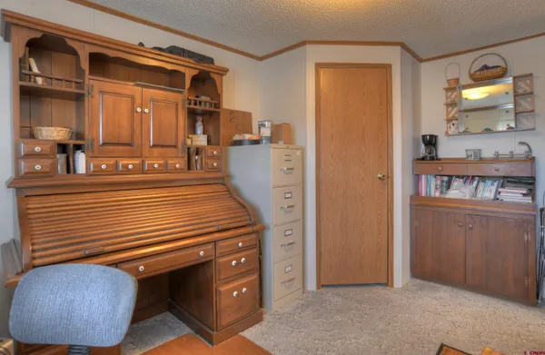 a room with closet a mirror and lamp