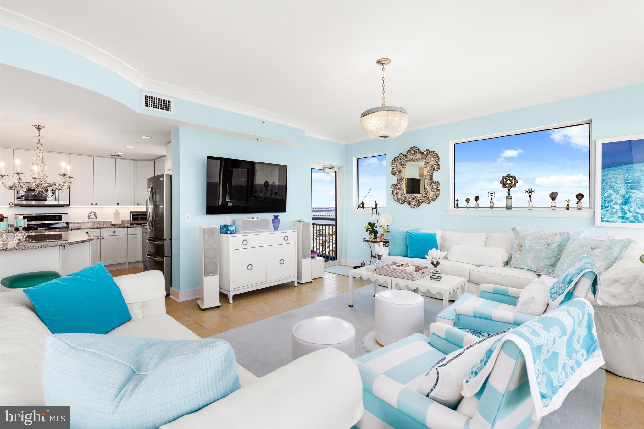 2 48th Street, Unit 1612 Ocean City, MD 21842 - Photo 12 of 90 a living room with furniture a flat screen tv and kitchen view