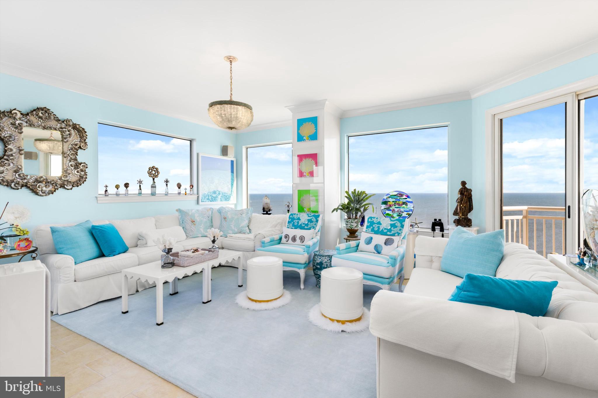 2 48th Street, Unit 1612 Ocean City, MD 21842 - Photo 13 of 90 a living room with furniture and a chandelier