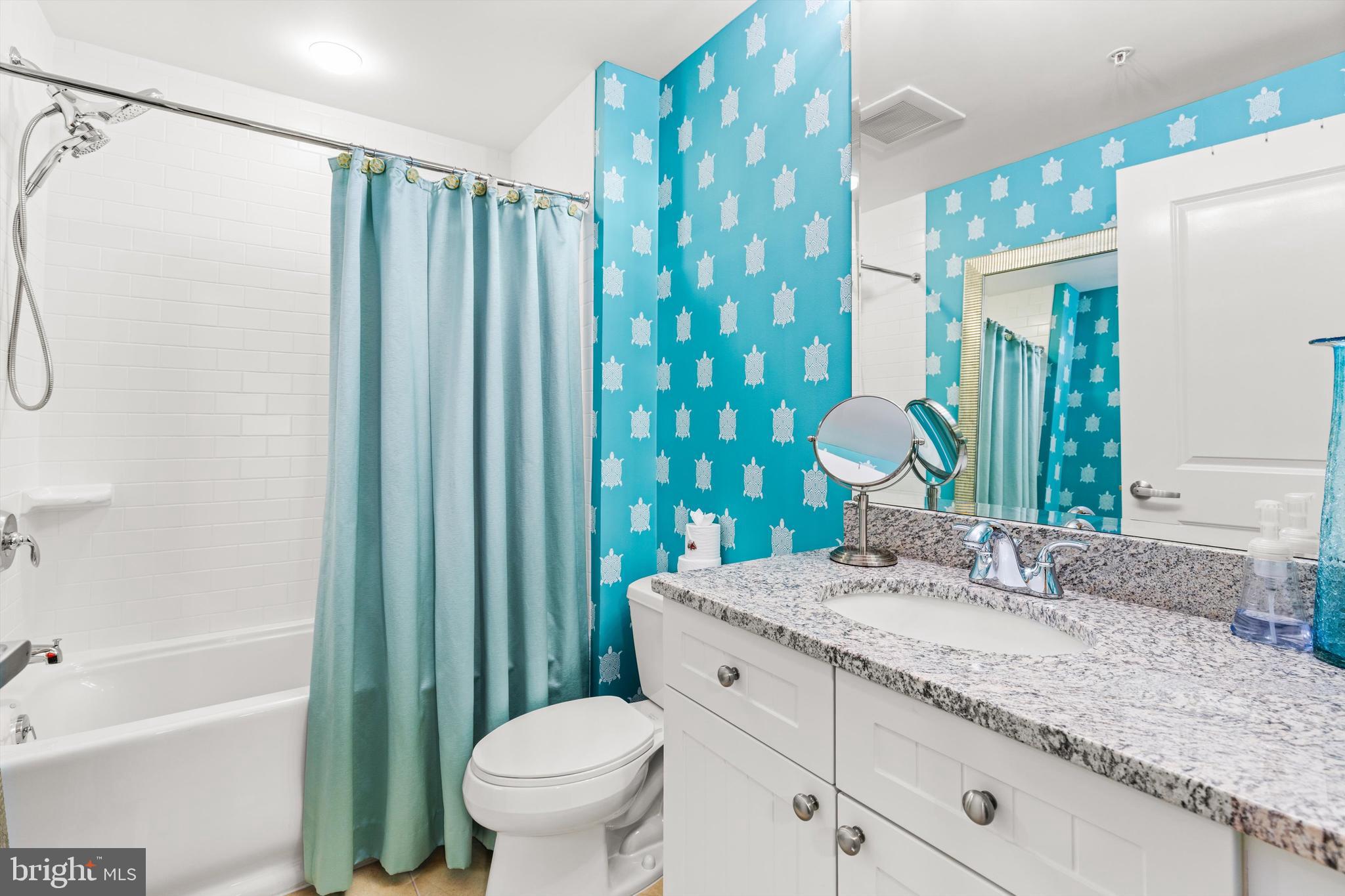 2 48th Street, Unit 1612 Ocean City, MD 21842 - Photo 30 of 90 a bathroom with a granite countertop sink toilet and shower