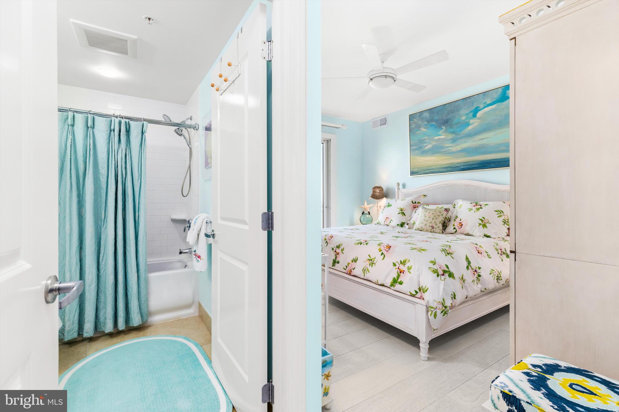 2 48th Street, Unit 1612 Ocean City, MD 21842 - Photo 32 of 90 a bedroom with a bed and a painting on the wall