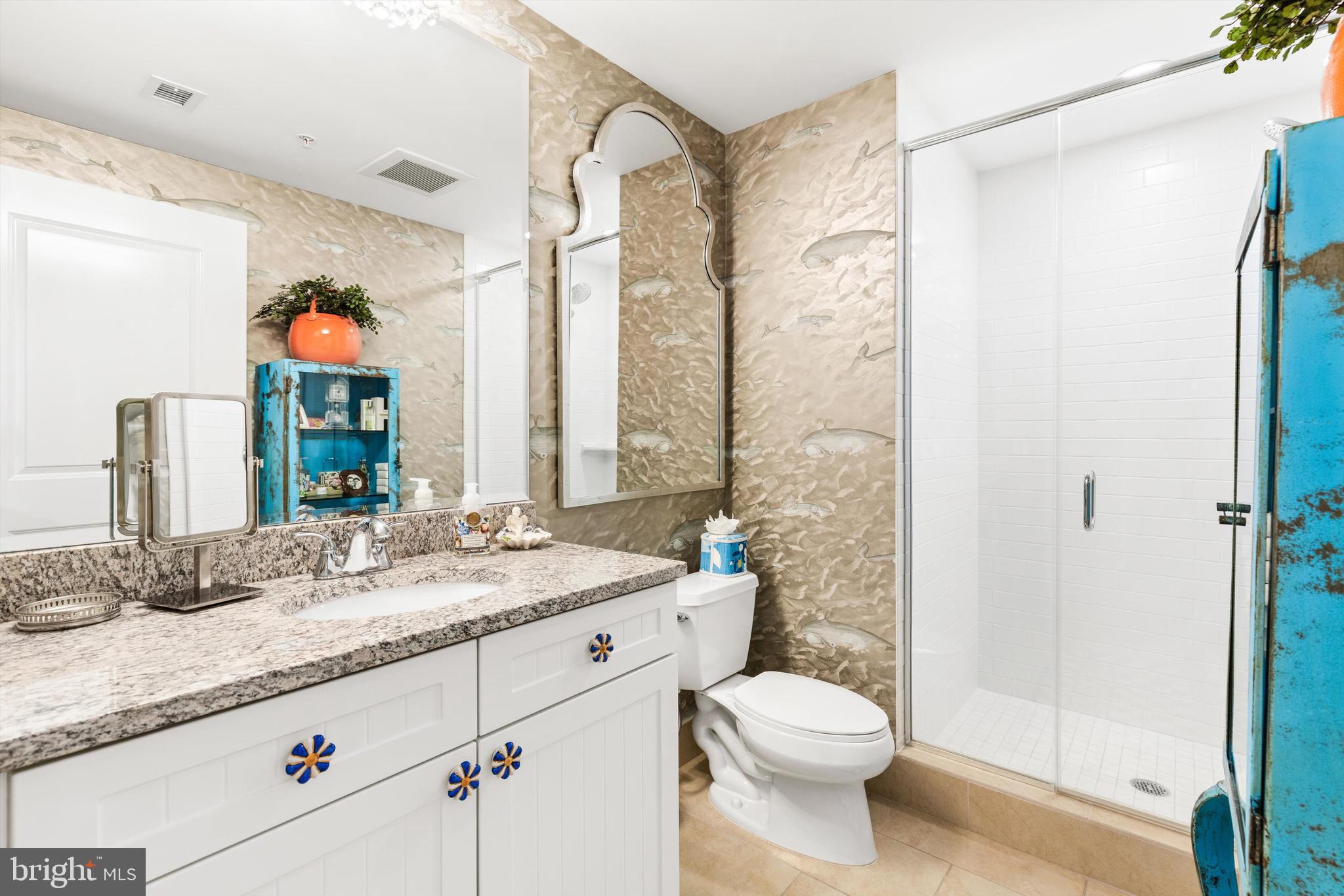 2 48th Street, Unit 1612 Ocean City, MD 21842 - Photo 37 of 90 a bathroom with a granite countertop sink mirror vanity and toilet
