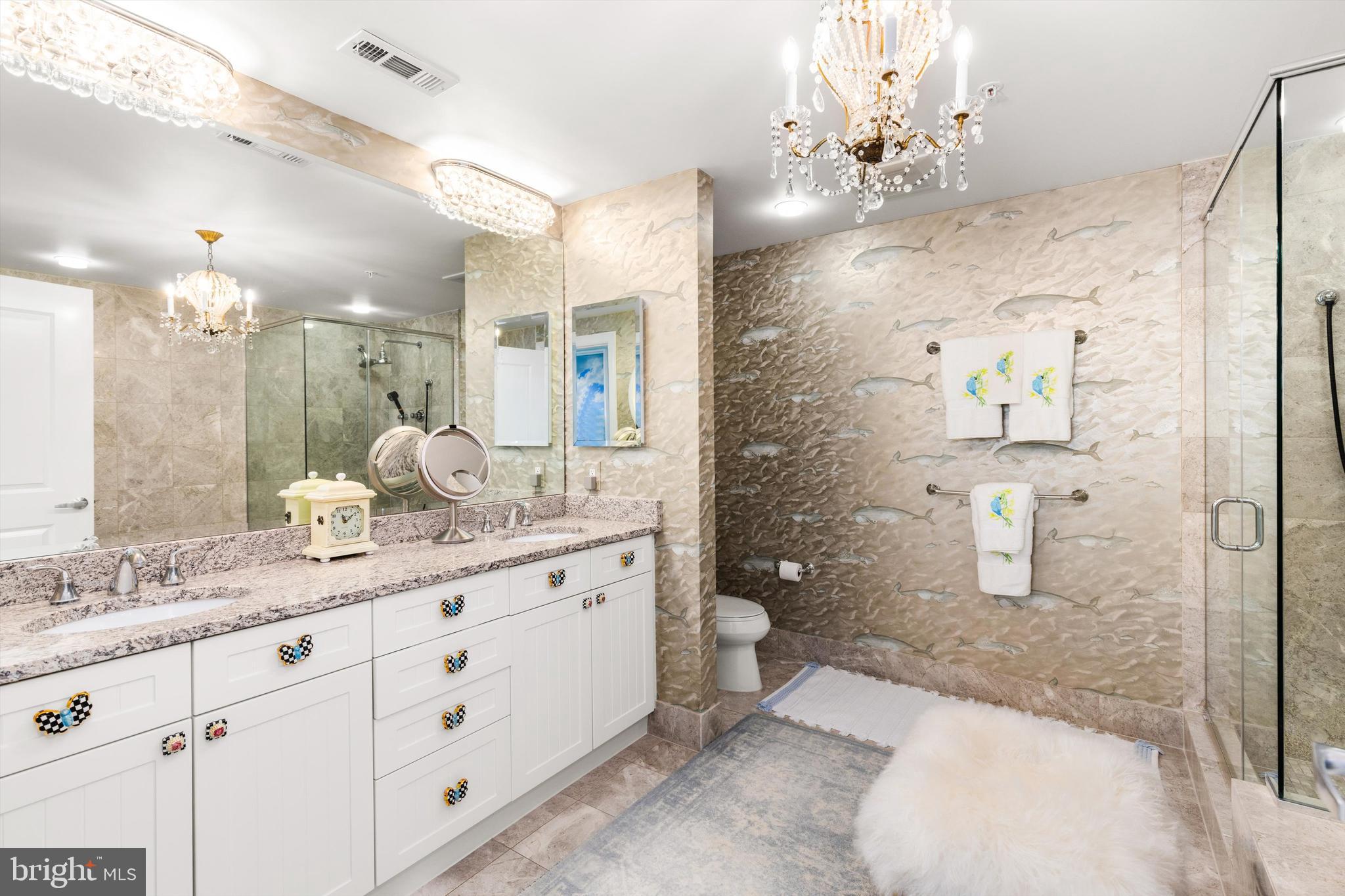 2 48th Street, Unit 1612 Ocean City, MD 21842 - Photo 44 of 90 a spacious bathroom with a granite countertop sink a toilet a mirror and shower