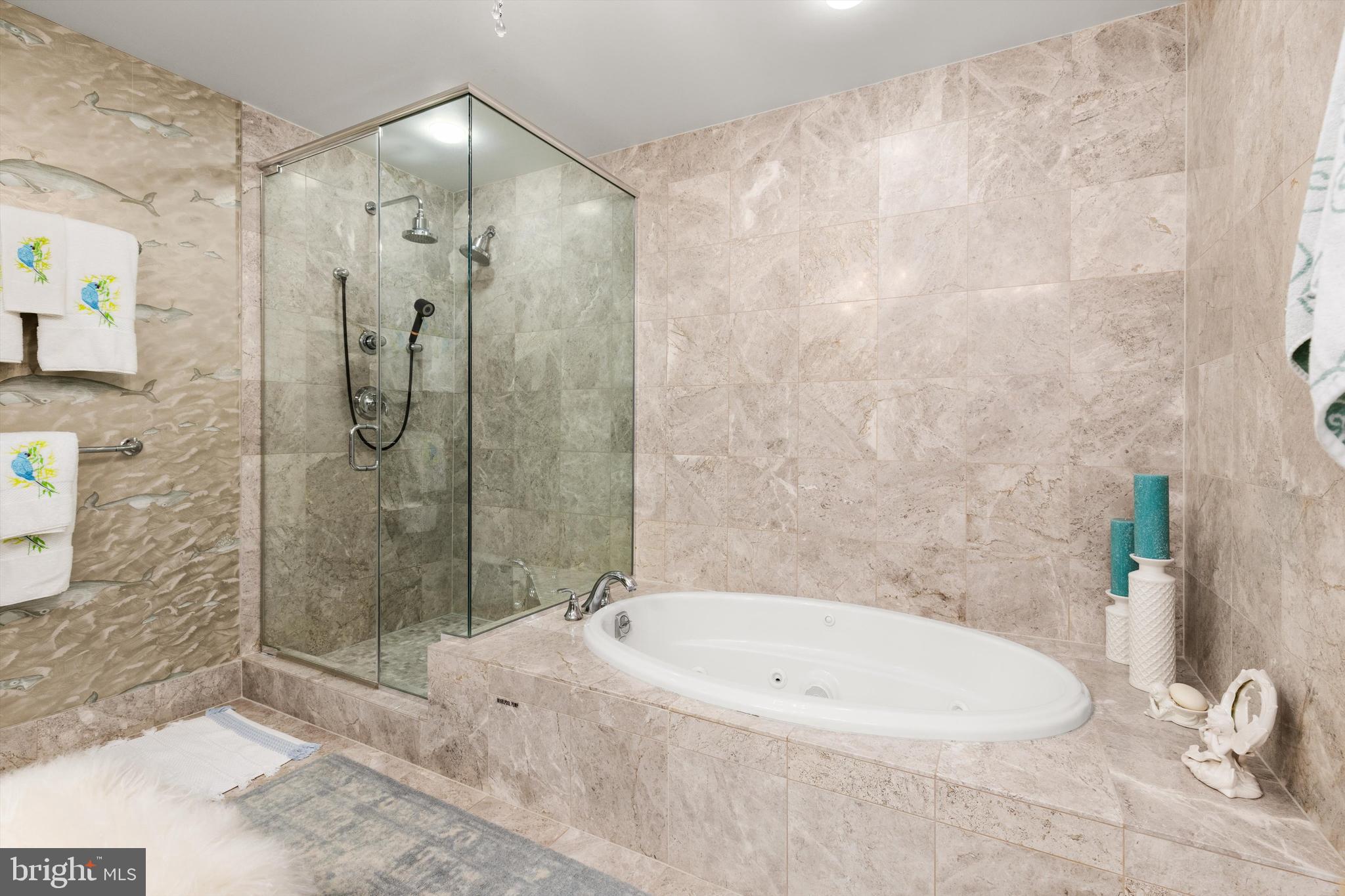 2 48th Street, Unit 1612 Ocean City, MD 21842 - Photo 45 of 90 a bathroom with a white bath tub a shower and a sink