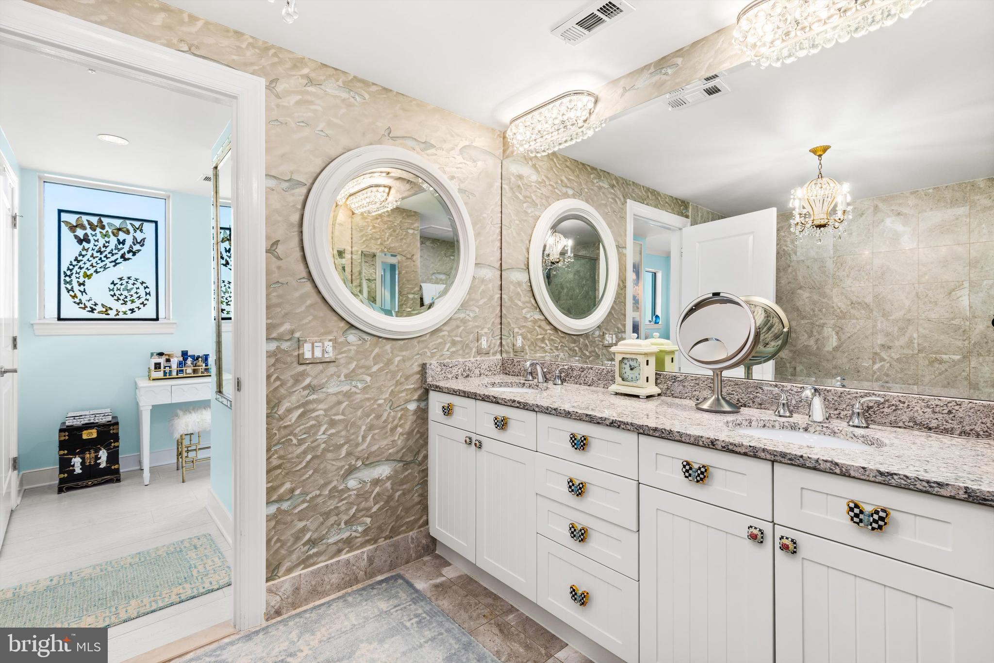 2 48th Street, Unit 1612 Ocean City, MD 21842 - Photo 47 of 90 a bathroom with a granite countertop sink and a mirror