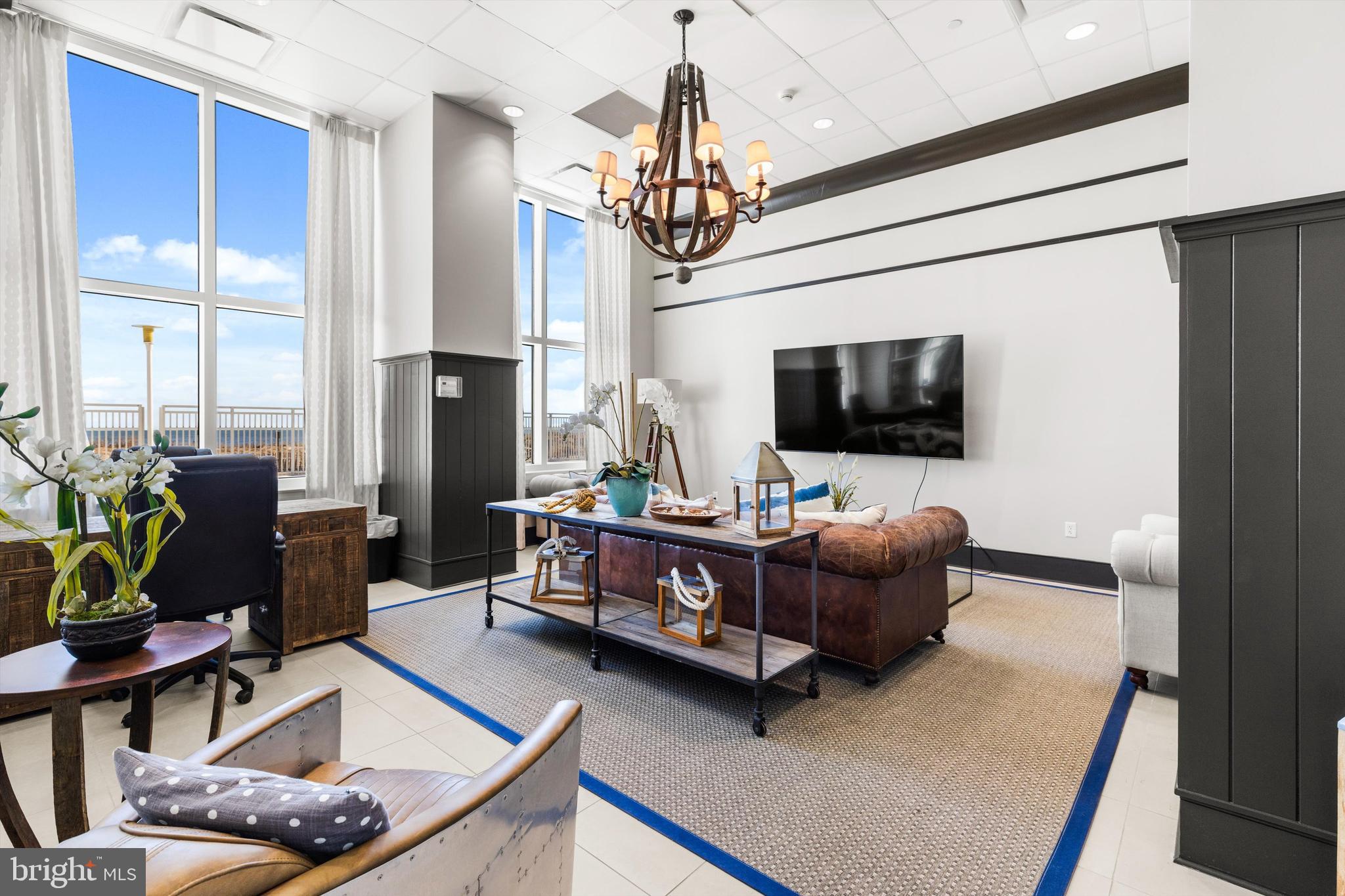 2 48th Street, Unit 1612 Ocean City, MD 21842 - Photo 62 of 90 a living room with furniture and a flat screen tv