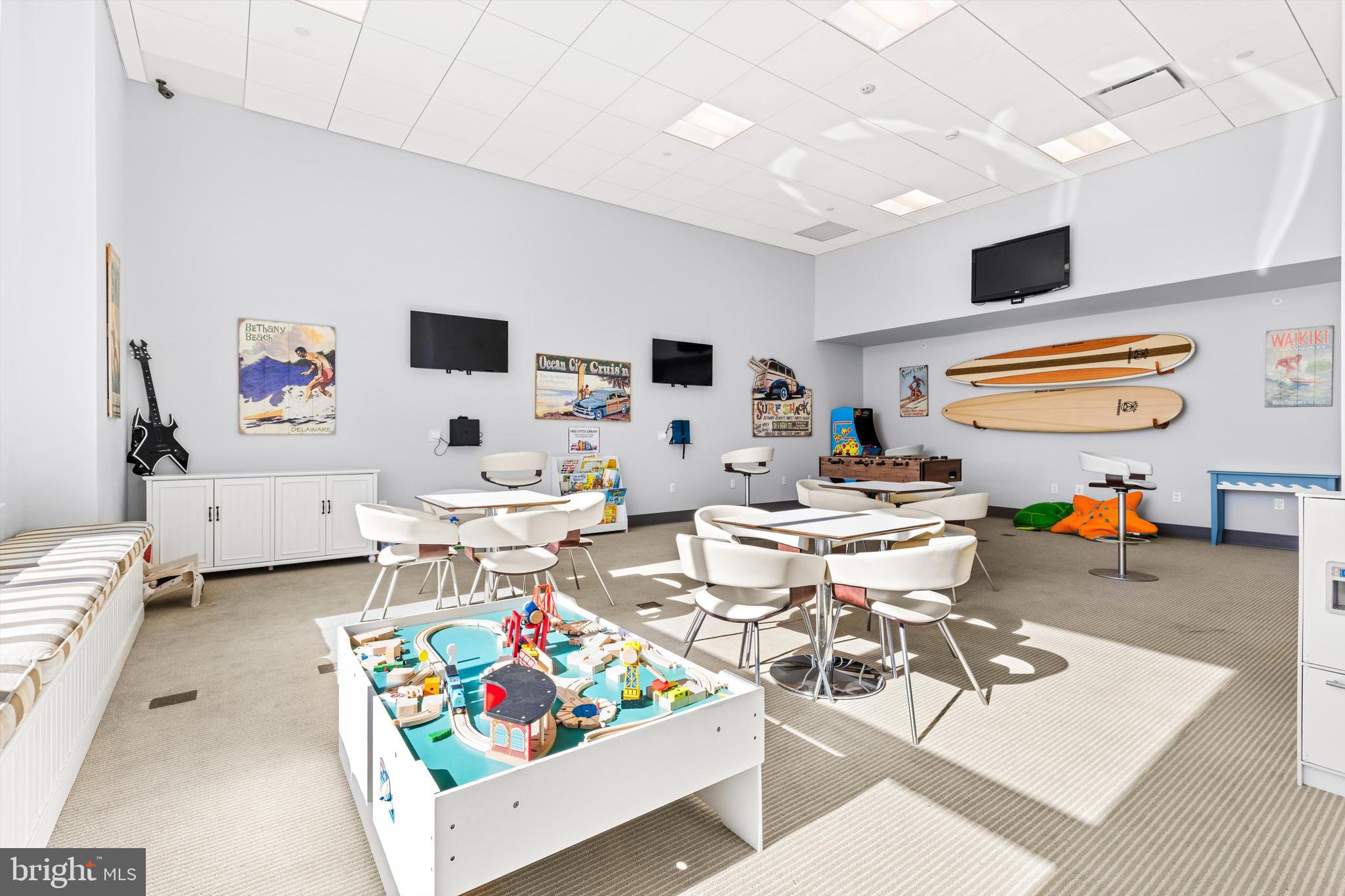 2 48th Street, Unit 1612 Ocean City, MD 21842 - Photo 82 of 90 a living room with furniture and a flat screen tv