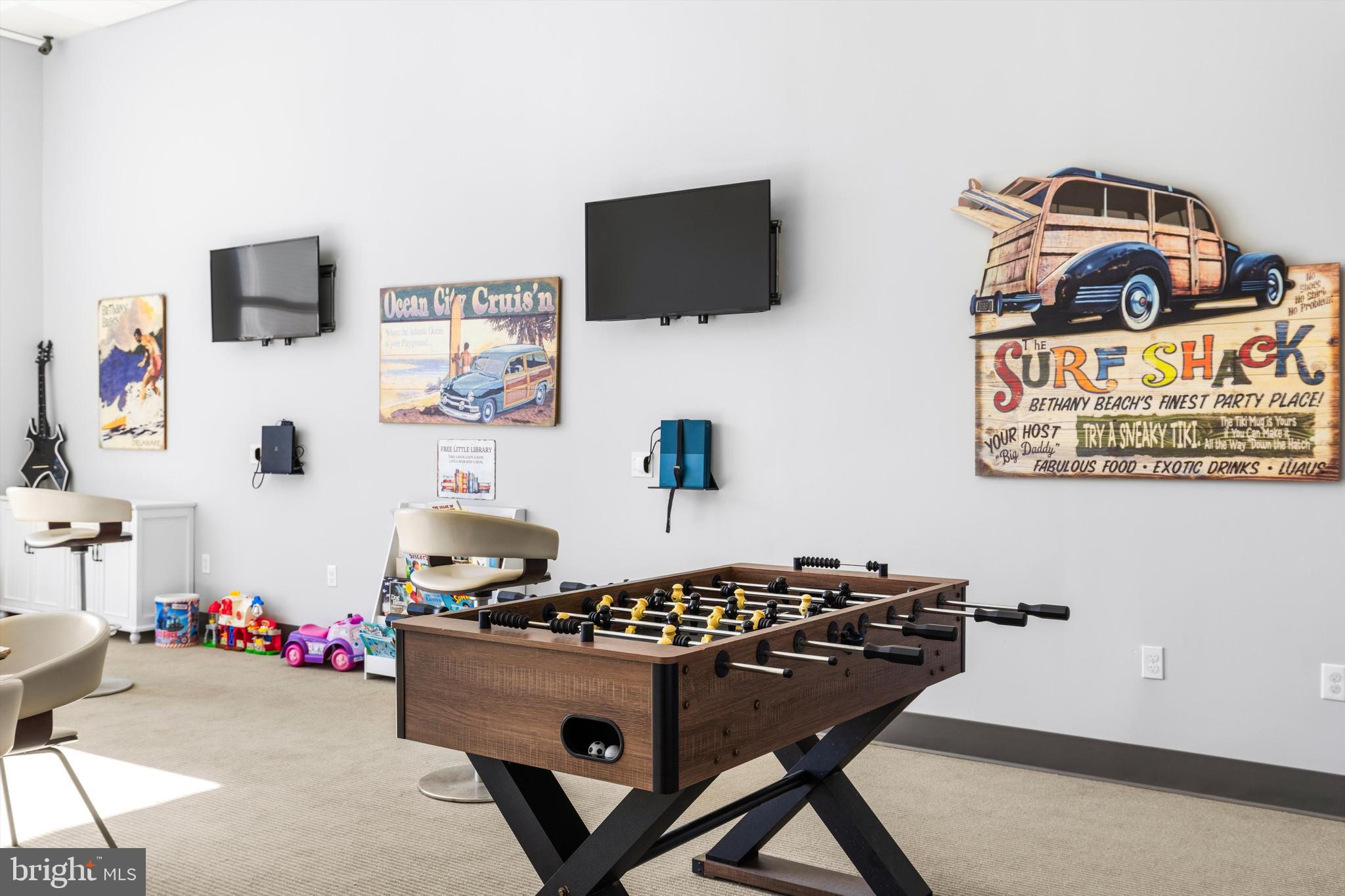 2 48th Street, Unit 1612 Ocean City, MD 21842 - Photo 83 of 90 a living room with furniture and a flat screen tv