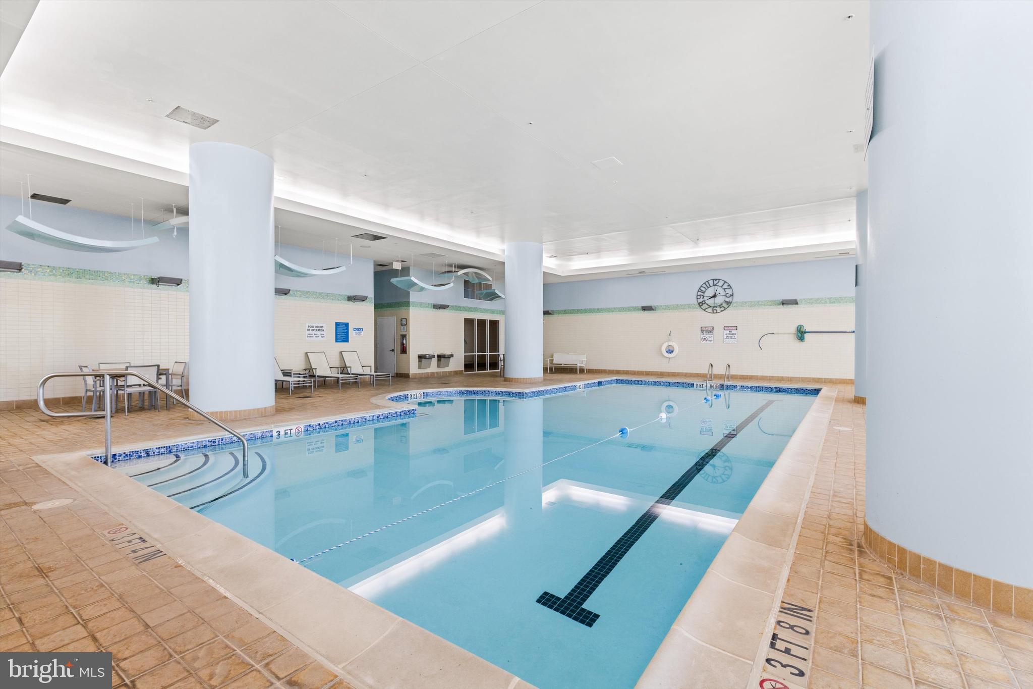 2 48th Street, Unit 1612 Ocean City, MD 21842 - Photo 87 of 90 a view of a kitchen with kitchen island a sink wooden floor and living room view
