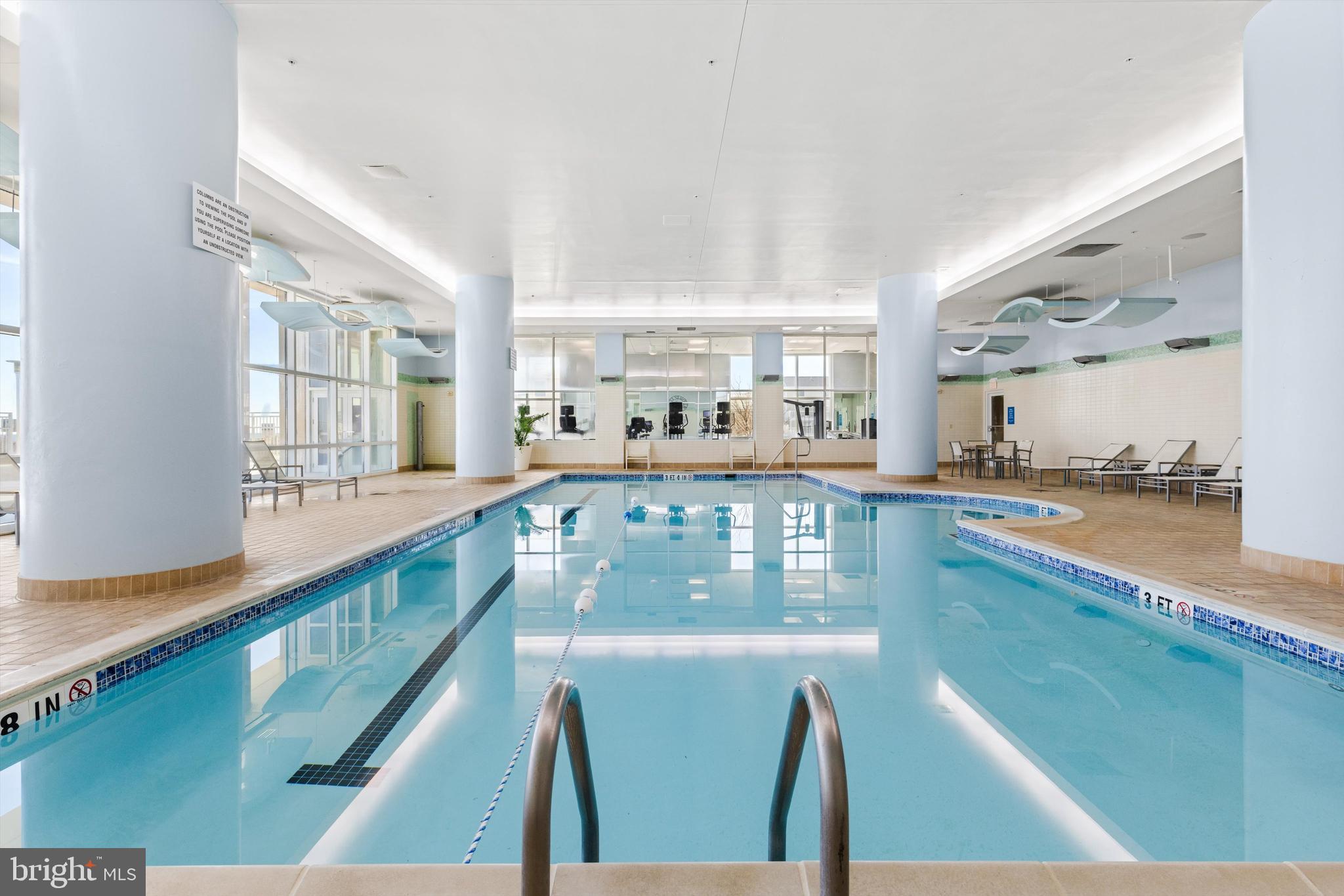 2 48th Street, Unit 1612 Ocean City, MD 21842 - Photo 88 of 90 a view of a dining room with furniture next to a window