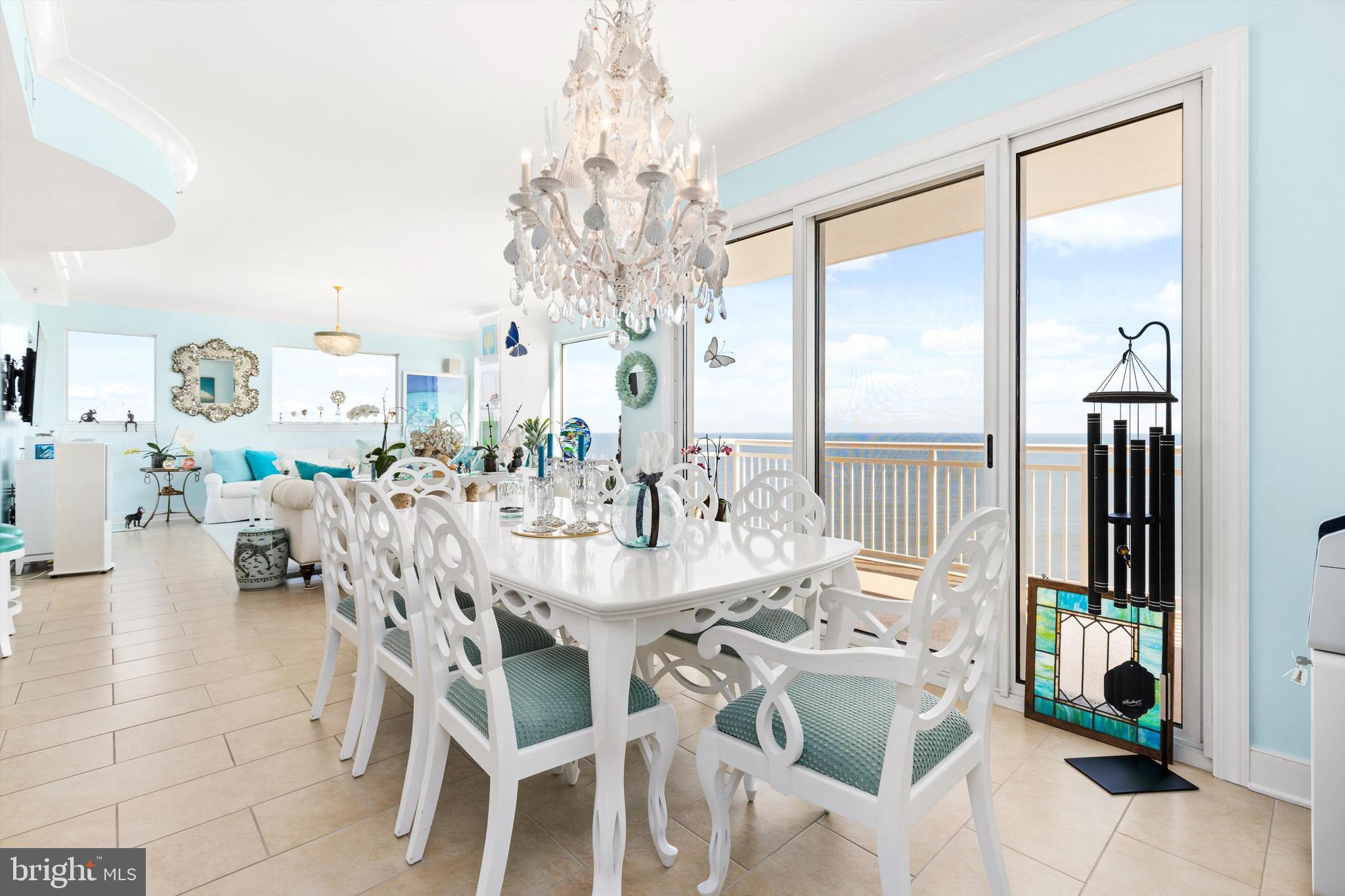 2 48th Street, Unit 1612 Ocean City, MD 21842 - Photo 10 of 90 a dining room with furniture a chandelier and a rug