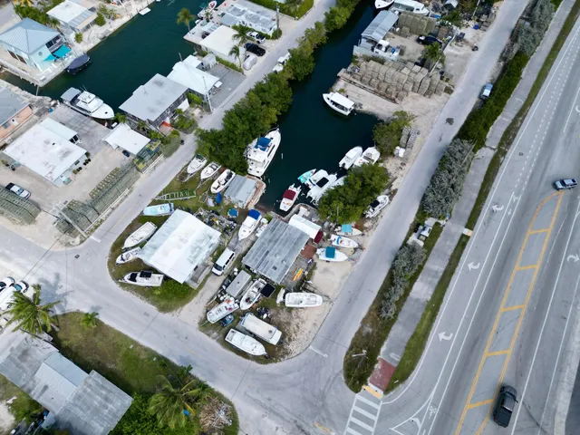 an aerial view of a house patio swimming pool and outdoor seating