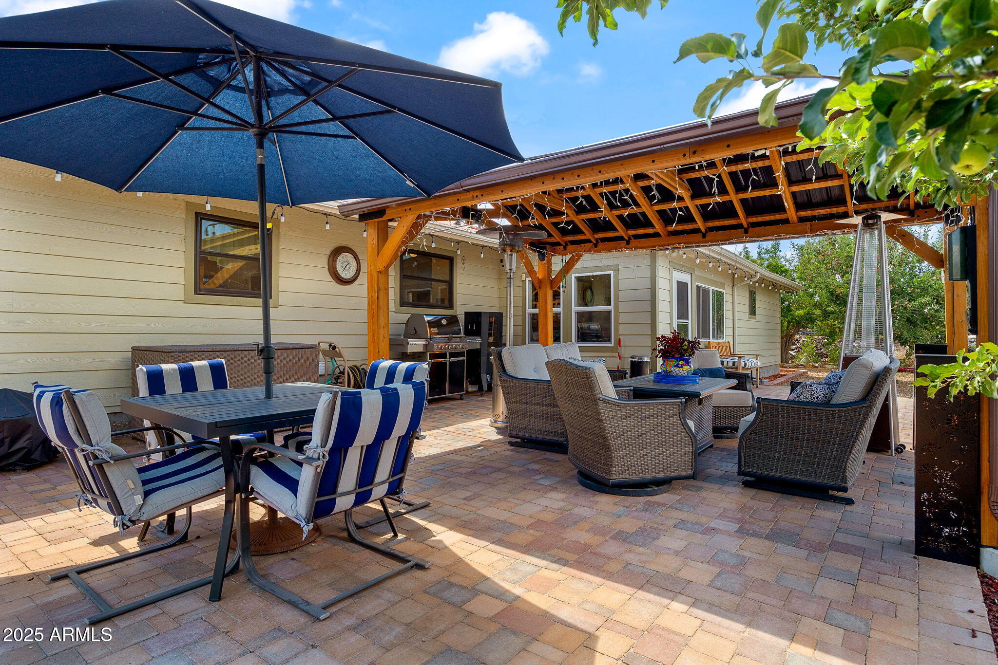 320 East 4th Avenue Eagar, AZ 85925 - Photo 24 of 38 a view of a patio with table and chairs under an umbrella