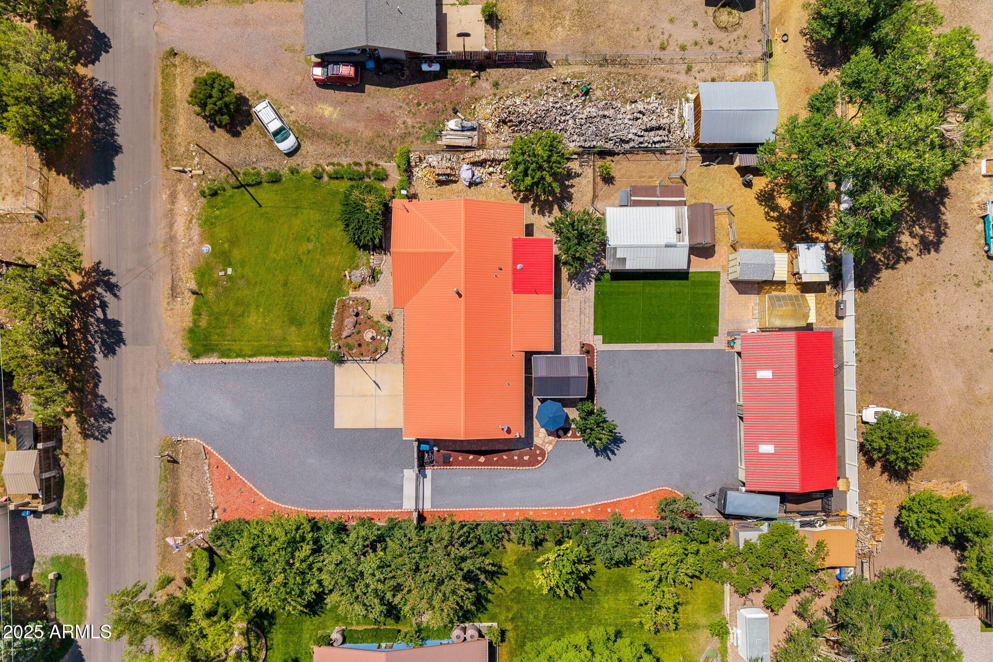 320 East 4th Avenue Eagar, AZ 85925 - Photo 32 of 38 an aerial view of a house with a yard and tennis court