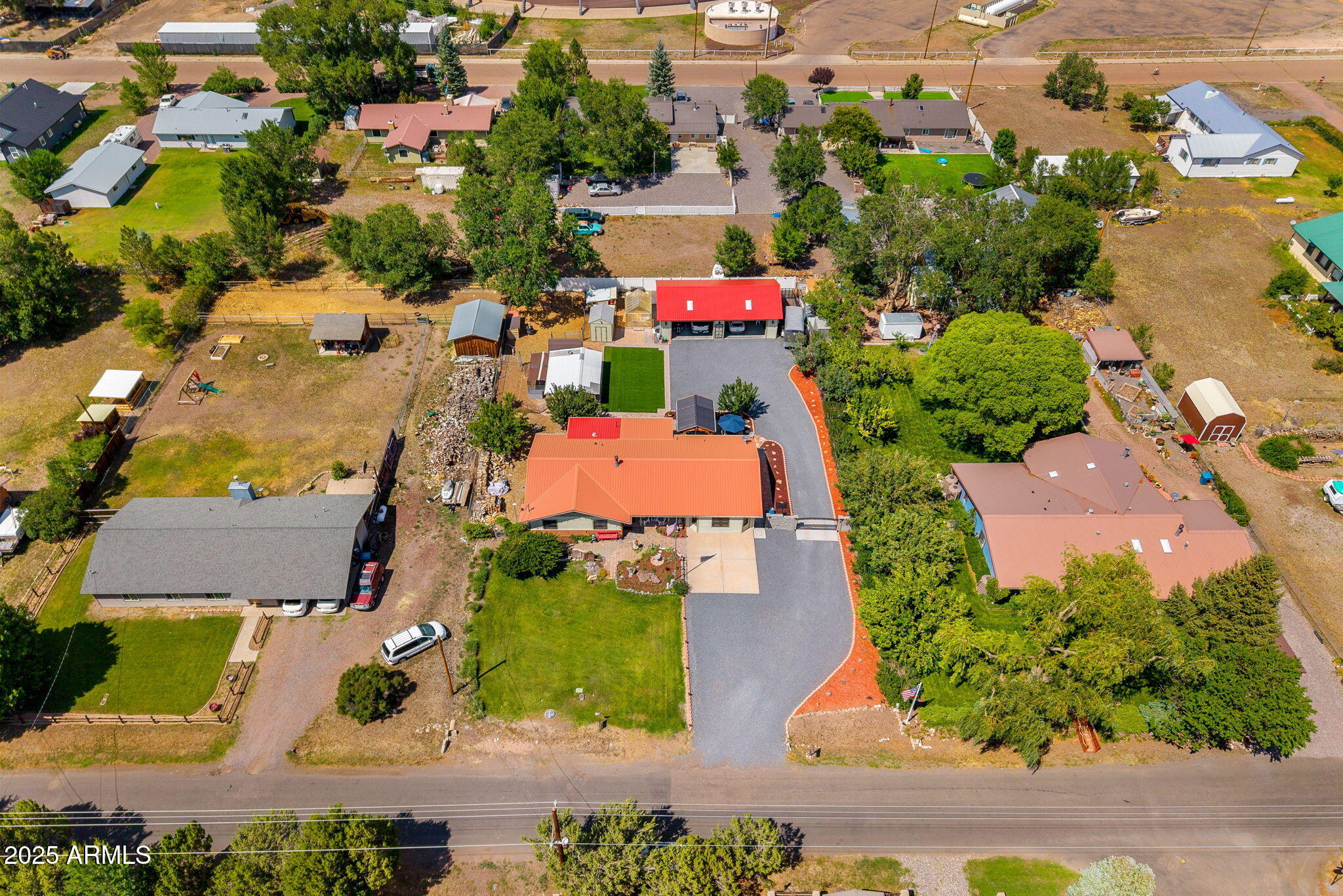 320 East 4th Avenue Eagar, AZ 85925 - Photo 33 of 38 an aerial view of multiple houses with yard