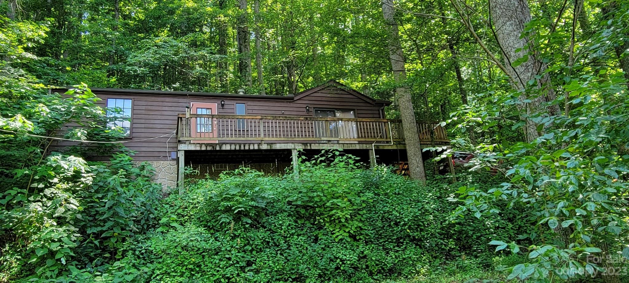 53 Eddie Cody Road Marshall, NC 28753 - Photo 1 of 10 a view of house with backyard