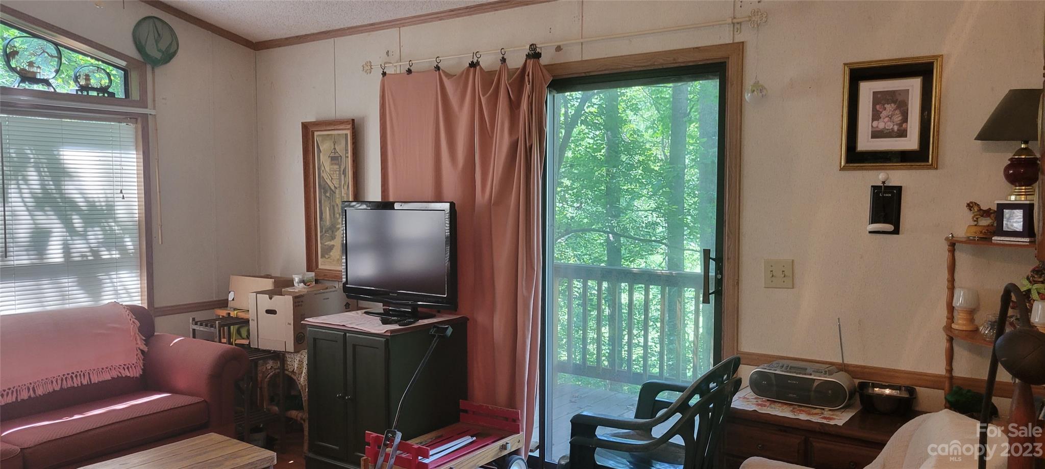 53 Eddie Cody Road Marshall, NC 28753 - Photo 2 of 10 a room with furniture and a window