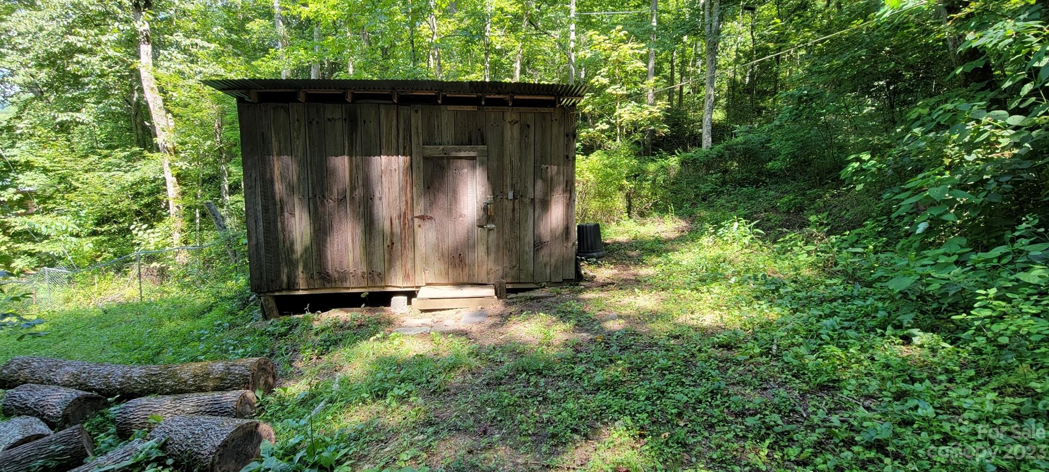 53 Eddie Cody Road Marshall, NC 28753 - Photo 6 of 10 a wooden door with trees in the background