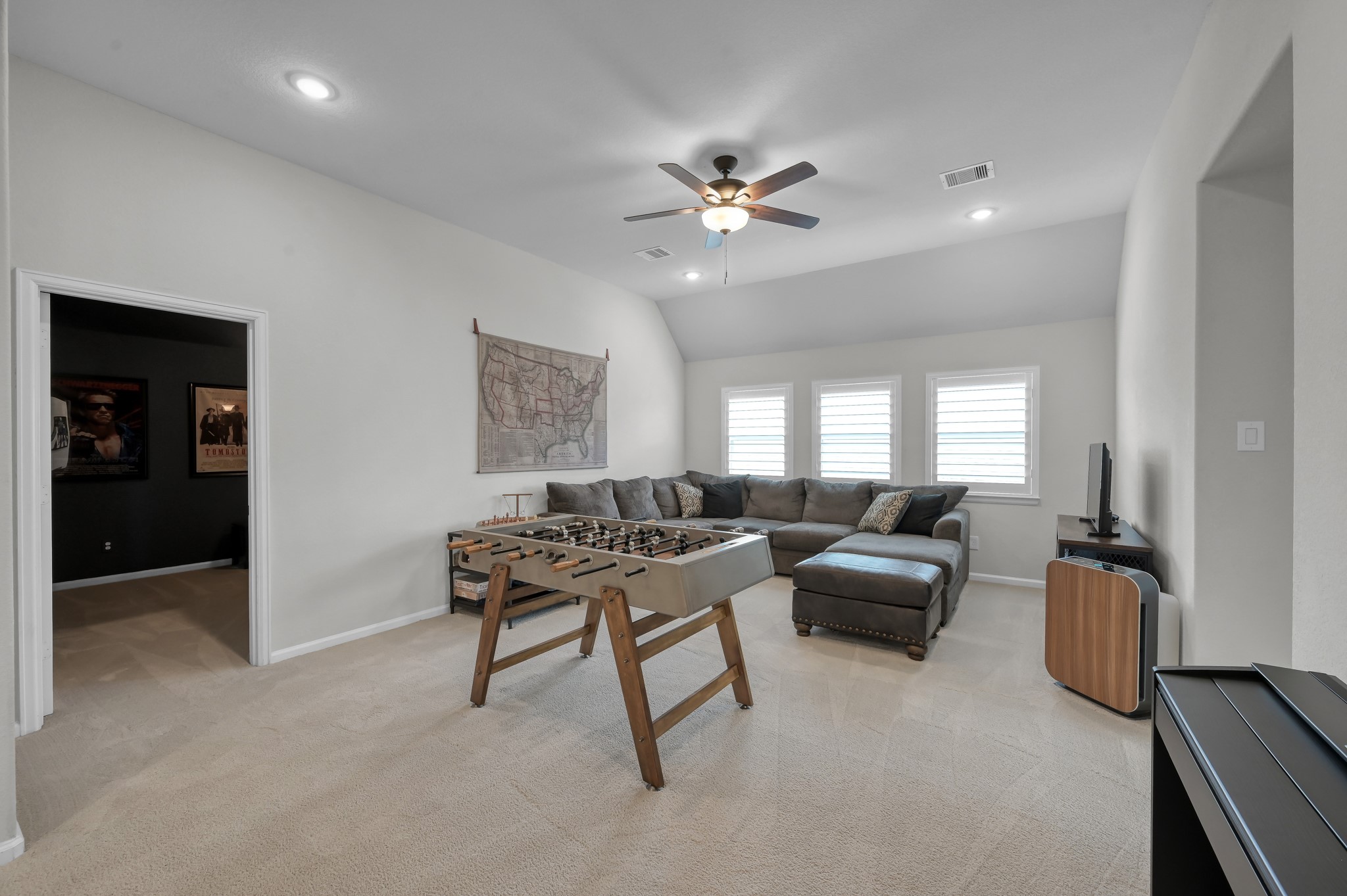 25015 Karacabey Court Spring, TX 77389 - Photo 30 of 49 The door on the left is the theater room and to the right you will find 2 bedrooms and 2 full bathrooms.