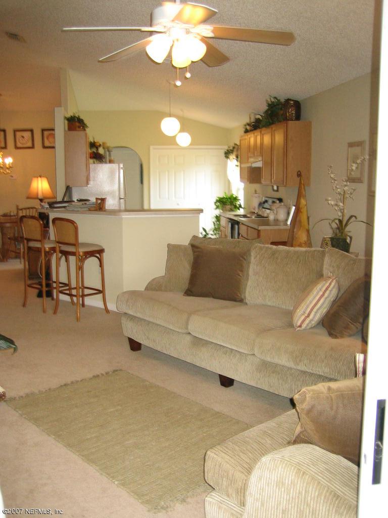 12584 North Reeding Ridge Drive West Jacksonville, FL 32225 - Photo 8 of 35 Family room w/ wonderful lake views