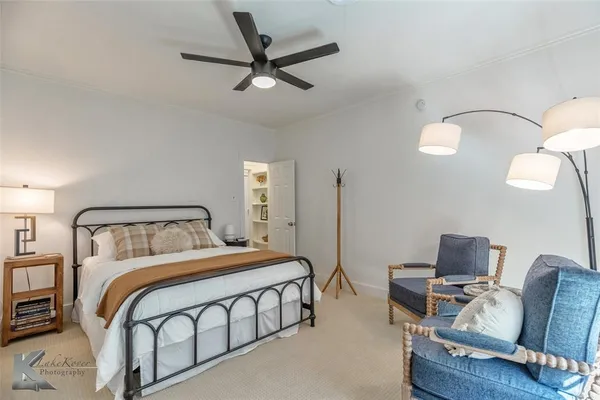 a bedroom with furniture and a window