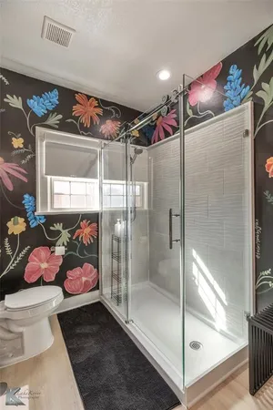 a bedroom with a bed and ceiling fan
