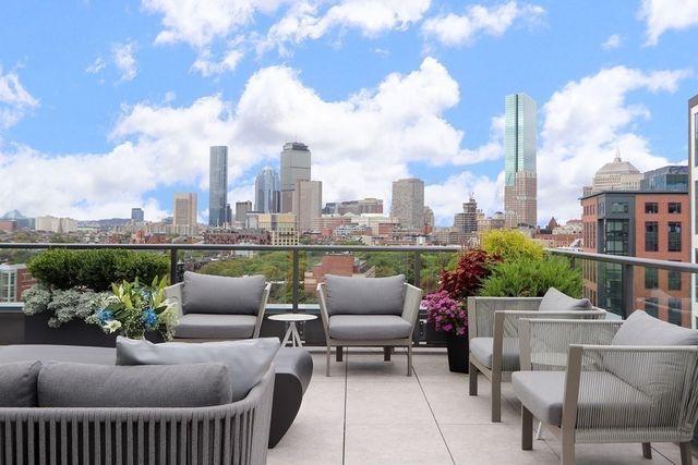 a view of a terrace with furniture