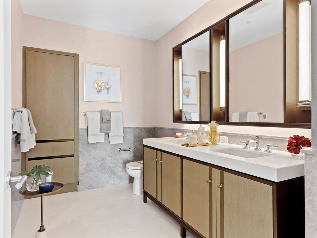 380 Harrison Avenue, Unit 12J Boston, MA 02118 - Photo 12 of 42 a bathroom with a sink and a mirror