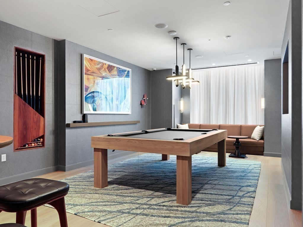 380 Harrison Avenue, Unit 12J Boston, MA 02118 - Photo 29 of 42 a room with pool table and windows