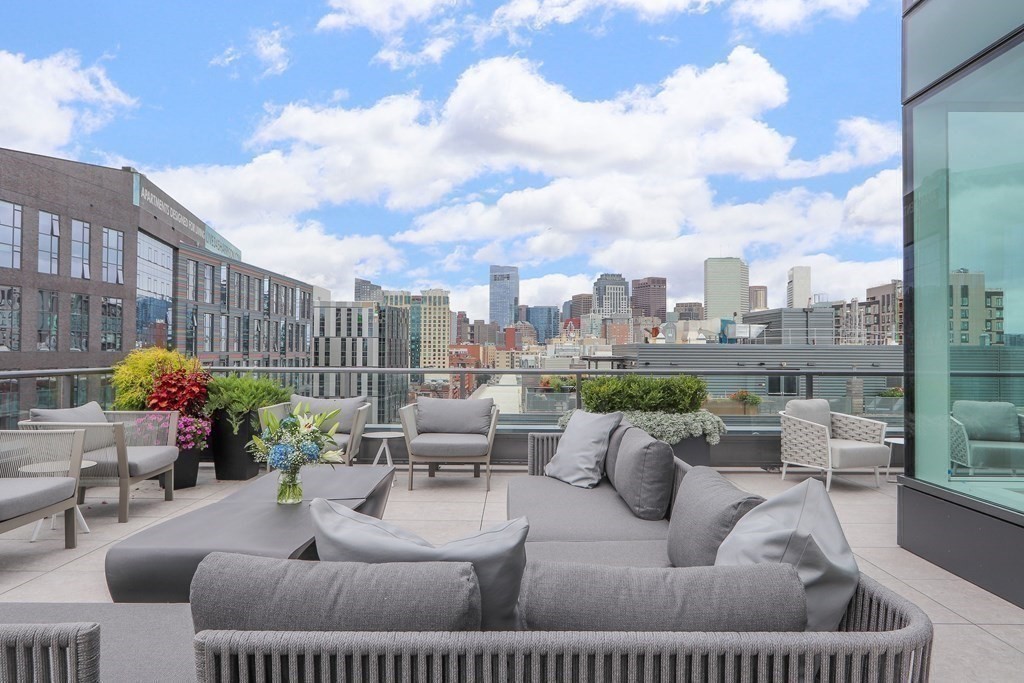 380 Harrison Avenue, Unit 12J Boston, MA 02118 - Photo 4 of 42 a view of a roof deck with couches and potted plants