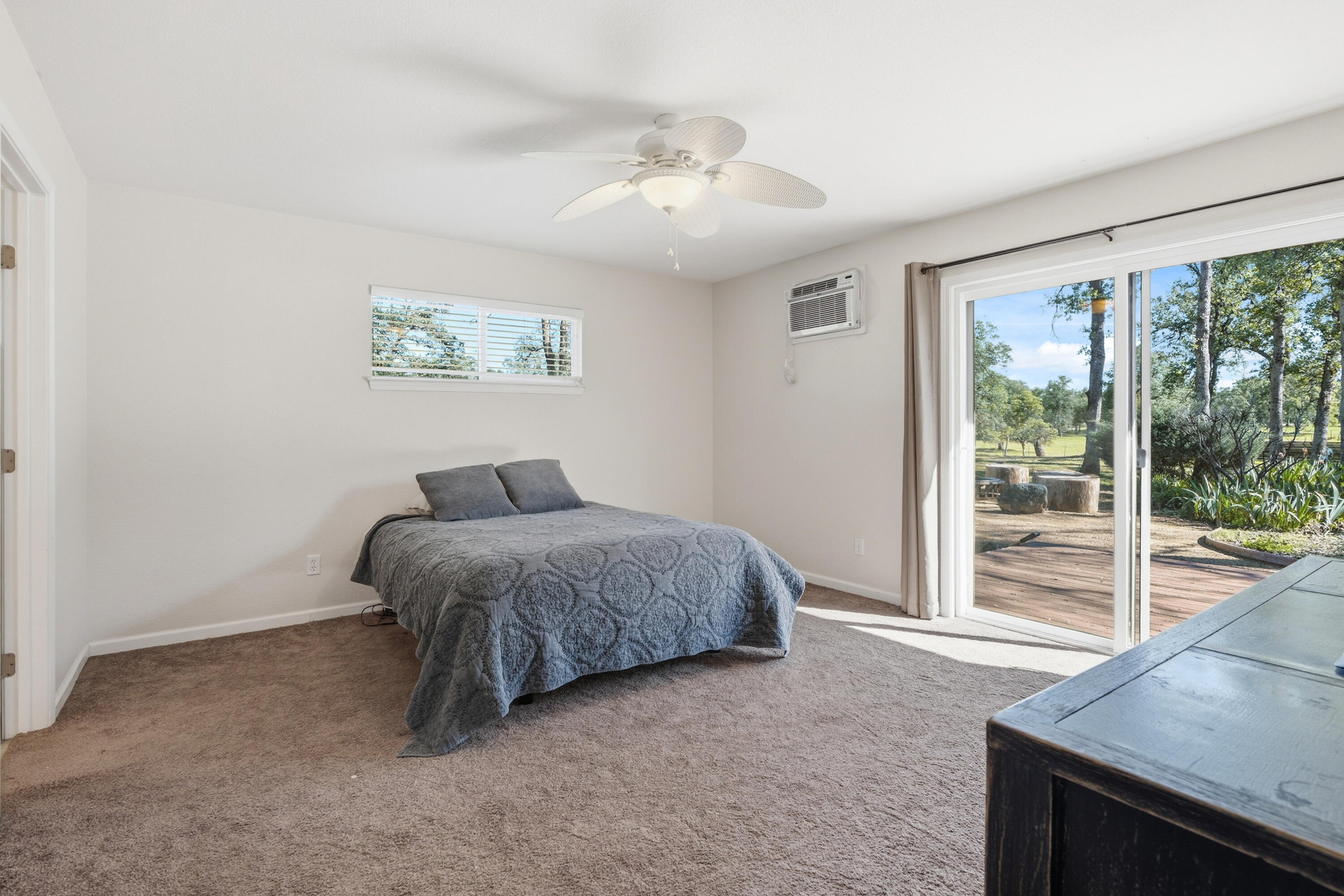 11385 Easy Street Redding, CA 96003 - Photo 40 of 55 a spacious bedroom with a bed and a large window