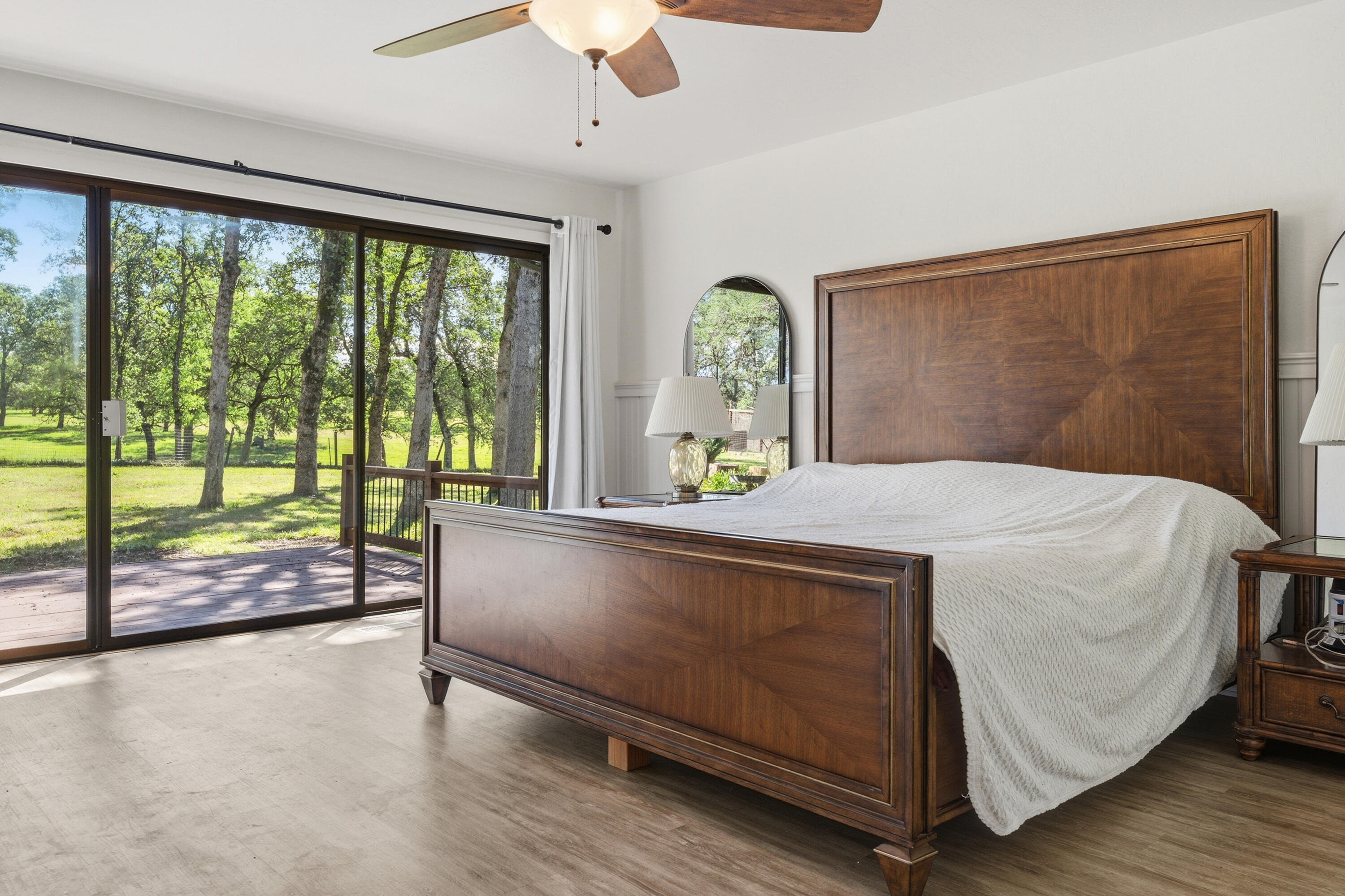 11385 Easy Street Redding, CA 96003 - Photo 7 of 55 a bed sitting in a spacious bedroom next to a large window