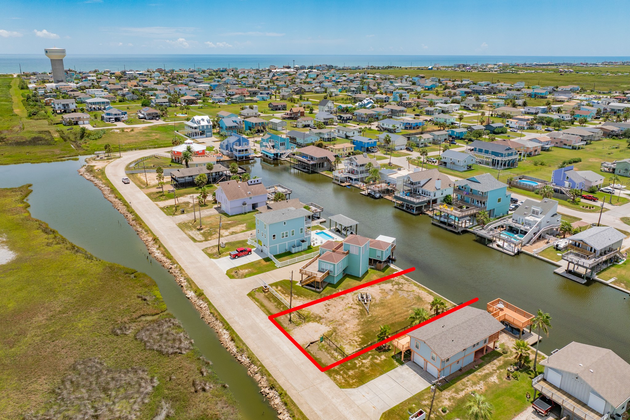 an aerial view of a house with a lake view