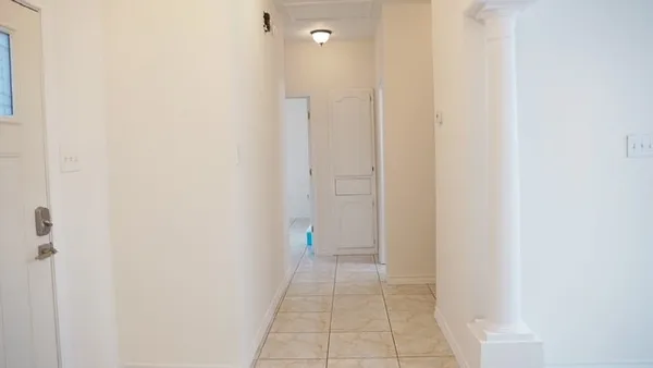 a white toilet sitting next to a shower curtain