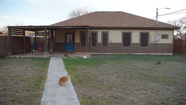 a backyard of a house with lots of green space
