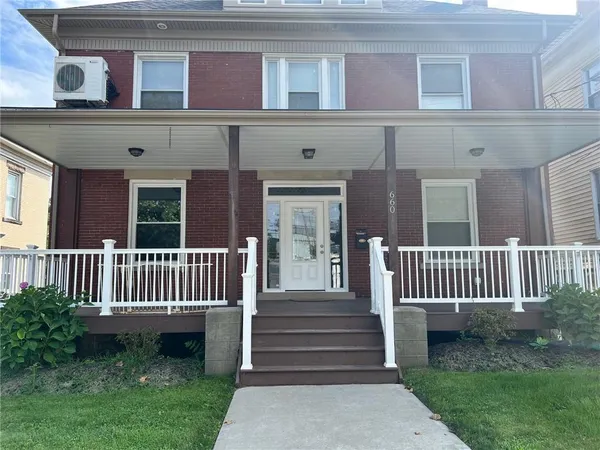 front view of a house with a yard