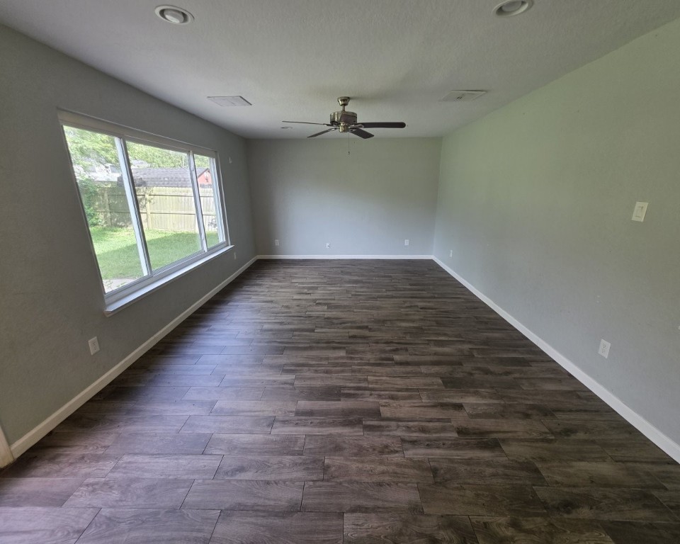 129 Corral Court Angleton, TX 77515 - Photo 2 of 26 Spacious living area with a view of the backyard