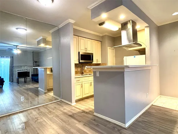 a view of a kitchen with a sink and a window